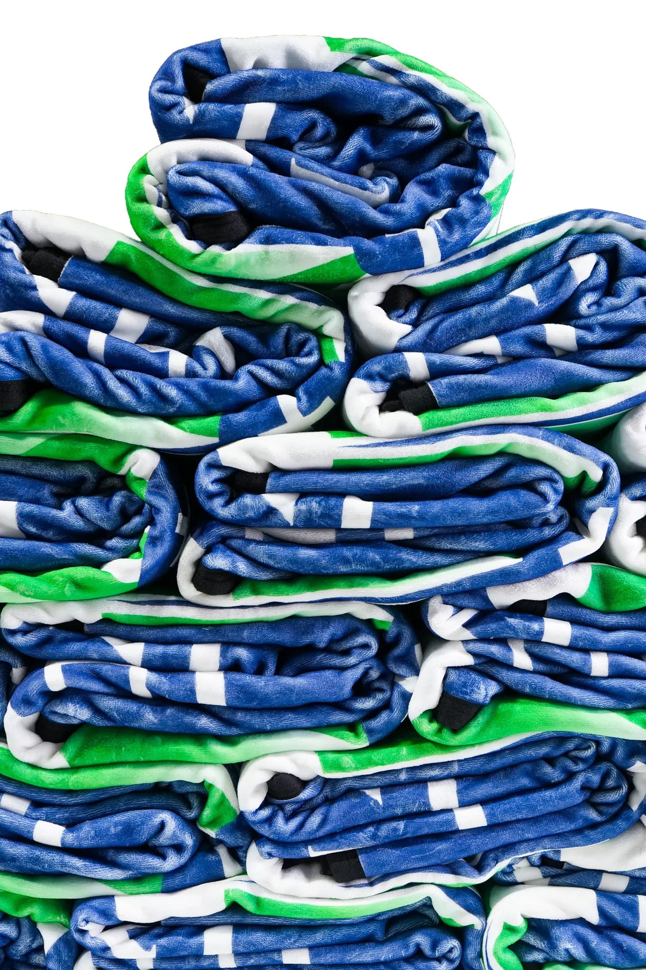 A neat stack of folded custom school blankets showing edge stitching and plush weight